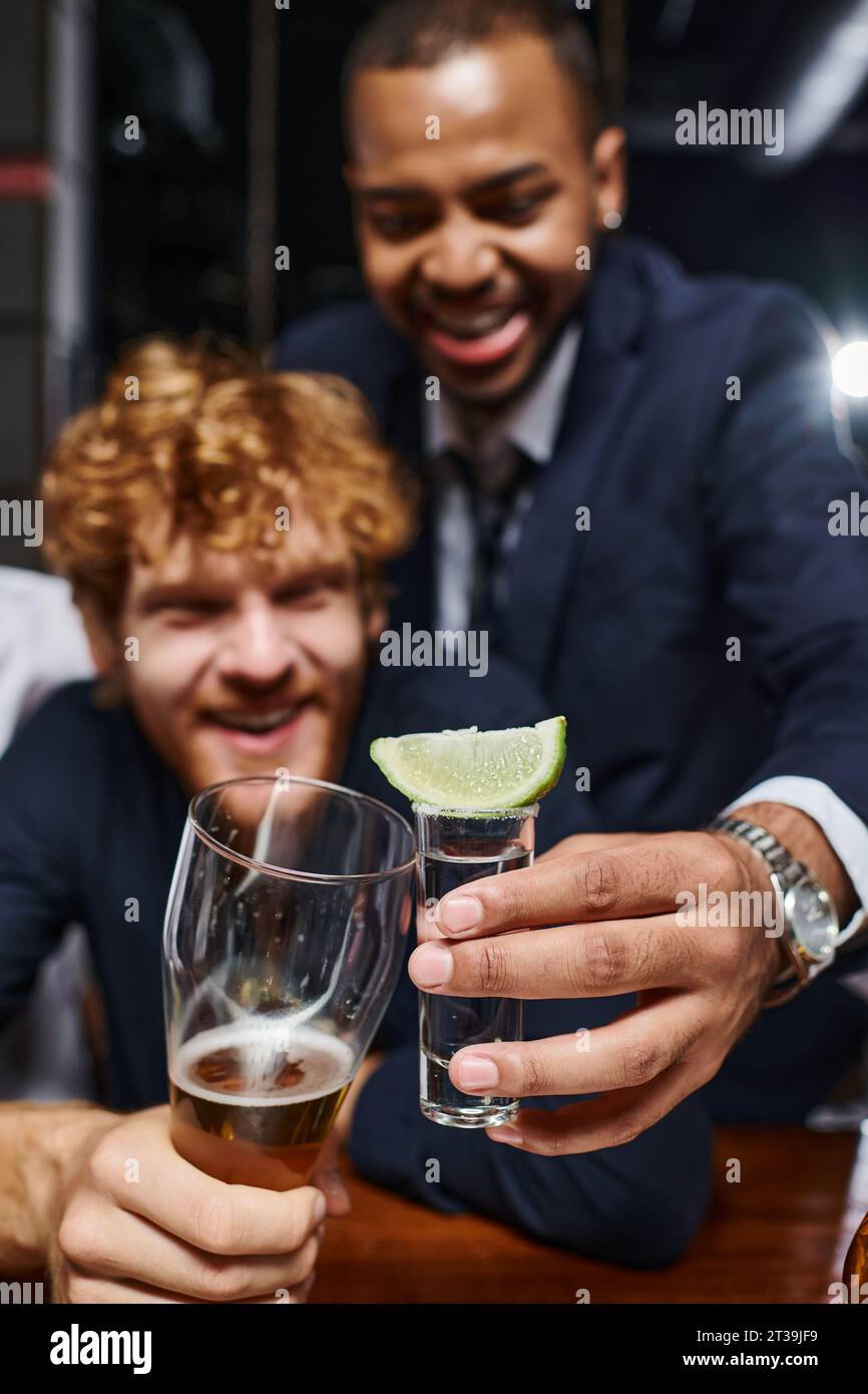 Two male friends clinking glasses hi-res stock photography and images ...