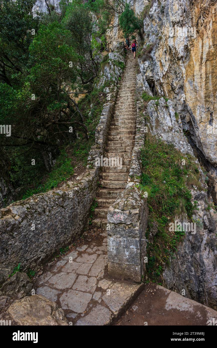 ascent of the stairs of Del Caballo lighthouse, Buciero mountain, Santoña, Cantabria, Spain Stock Photo