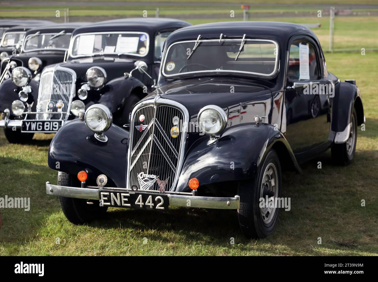 Three-quarter Front view of a 1938, Dark Blue, Citroën Traction Avant, 2-door, on display at the 2023 British Motor Show, Farnborough. Stock Photo