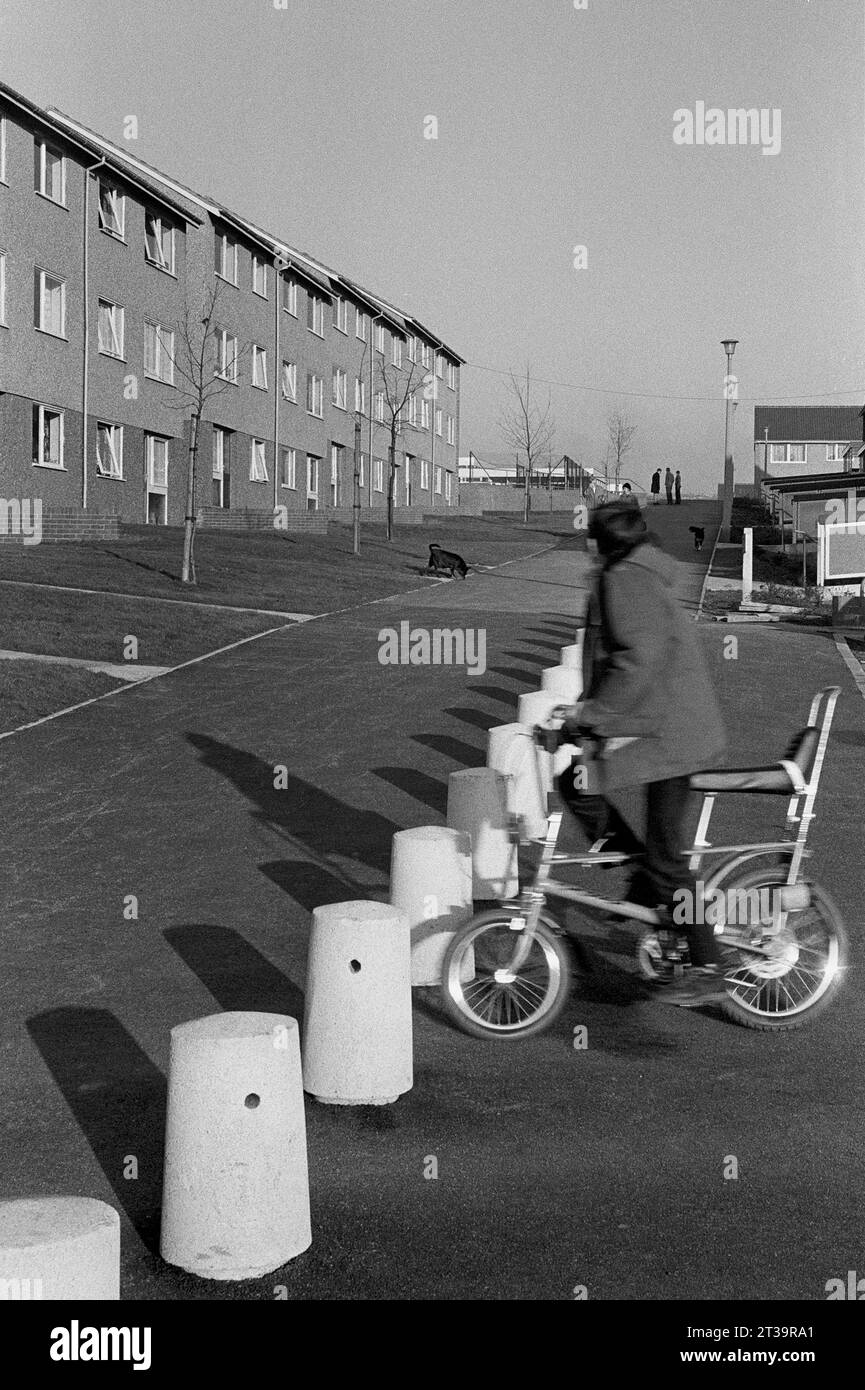 Boy riding a Raleigh Chopper Bike on a street of newly built houses during the slum clearance and demolition of St Ann's, Nottingham. 1969-1972 Stock Photo