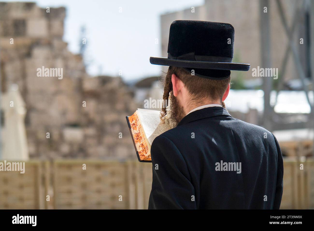 Jewish man prays at the Western wall in Jerusalem's Old City, Israel Stock Photo
