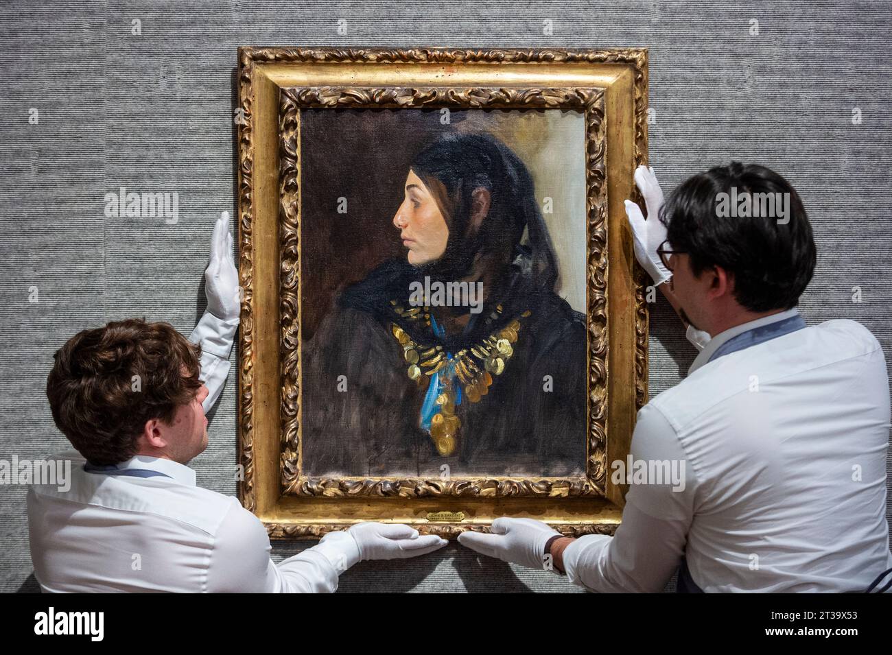 London, UK.  24 October 2023. Technicians present ‘Egyptian Woman (Coin Necklace)’, 1891, by John Singer Sargent (Est. US$1,200,000 - US$1,800,000) at Bonhams, New Bond Street.  The painting is one the highlights of the American Art collection of US journalist and television broadcaster Barbara Walters and the lots will be offered for sale at Bonhams New York on 6 November.     Credit: Stephen Chung / Alamy Live News Stock Photo