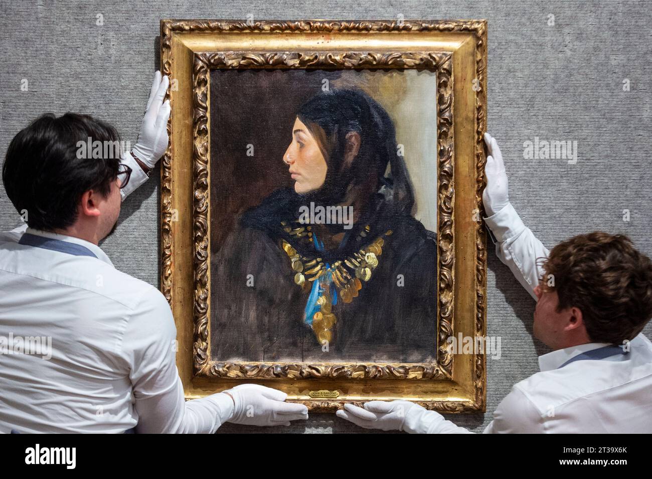 London, UK.  24 October 2023. Technicians present ‘Egyptian Woman (Coin Necklace)’, 1891, by John Singer Sargent (Est. US$1,200,000 - US$1,800,000) at Bonhams, New Bond Street.  The painting is one the highlights of the American Art collection of US journalist and television broadcaster Barbara Walters and the lots will be offered for sale at Bonhams New York on 6 November.     Credit: Stephen Chung / Alamy Live News Stock Photo
