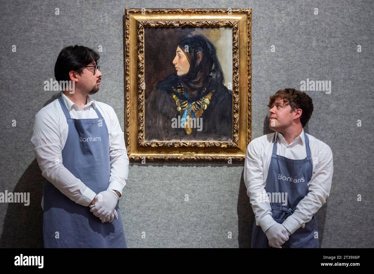 London, UK.  24 October 2023. Technicians present ‘Egyptian Woman (Coin Necklace)’, 1891, by John Singer Sargent (Est. US$1,200,000 - US$1,800,000) at Bonhams, New Bond Street.  The painting is one the highlights of the American Art collection of US journalist and television broadcaster Barbara Walters and the lots will be offered for sale at Bonhams New York on 6 November.     Credit: Stephen Chung / Alamy Live News Stock Photo