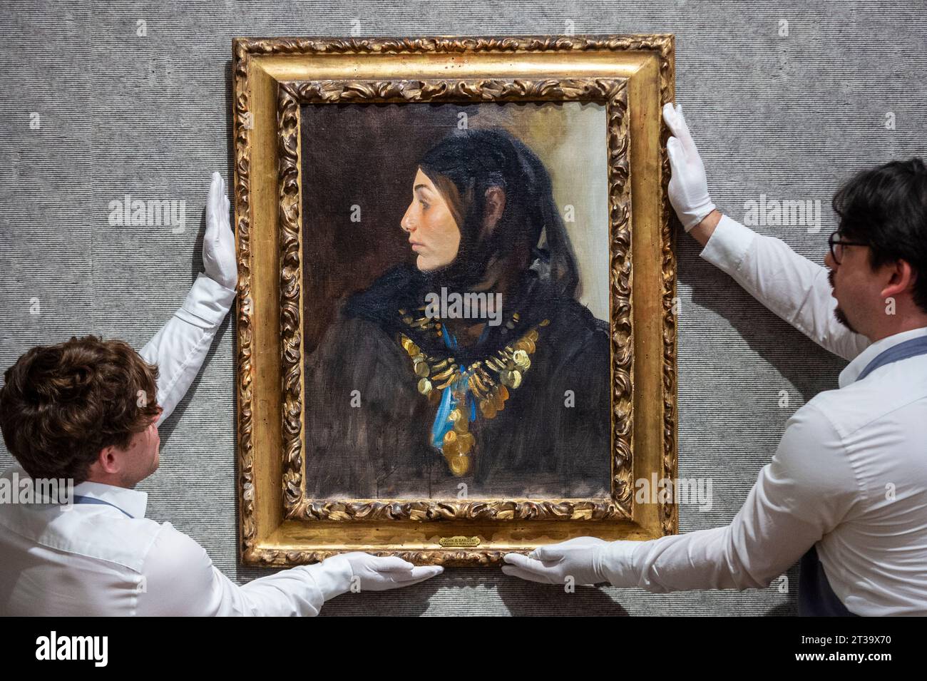 London, UK.  24 October 2023. Technicians present ‘Egyptian Woman (Coin Necklace)’, 1891, by John Singer Sargent (Est. US$1,200,000 - US$1,800,000) at Bonhams, New Bond Street.  The painting is one the highlights of the American Art collection of US journalist and television broadcaster Barbara Walters and the lots will be offered for sale at Bonhams New York on 6 November.     Credit: Stephen Chung / Alamy Live News Stock Photo