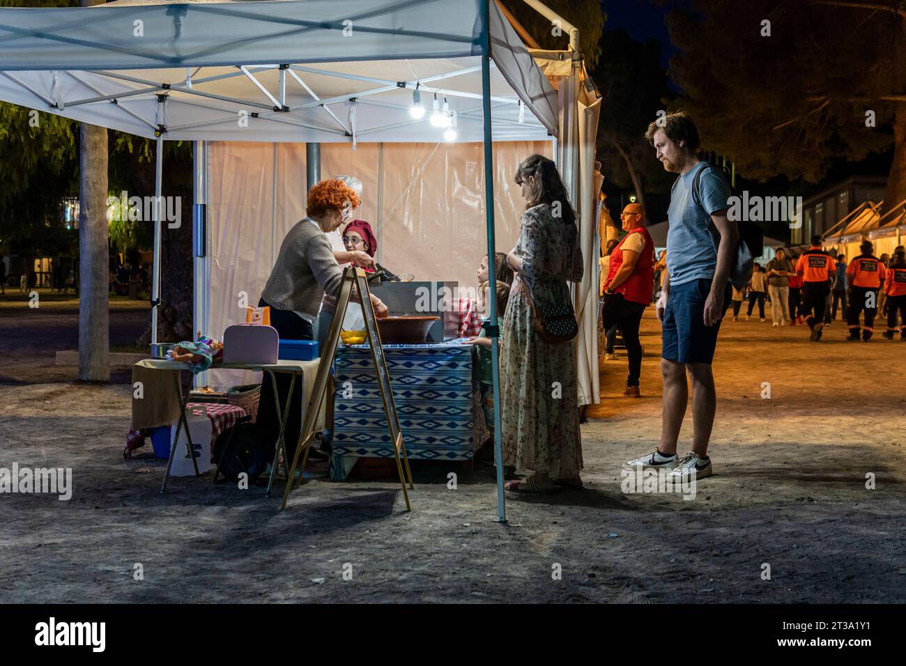 Felanitx, Spain; october 21 2023: Annual paprika fair in the Majorcan town of Felanitx, Spain. Street stalls selling local products with customers at Stock Photo