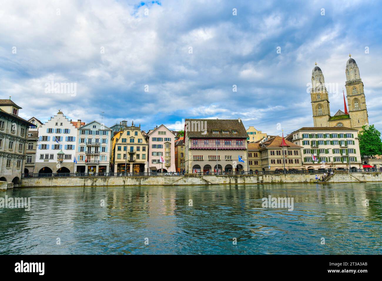 Scenic evenning view of historic Zurich city center with Grossmunster Church and river limmat , Switzerland Stock Photo