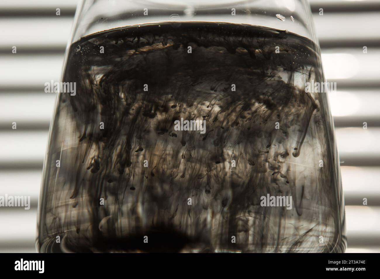 Ink water glass spreading hi-res stock photography and images - Alamy