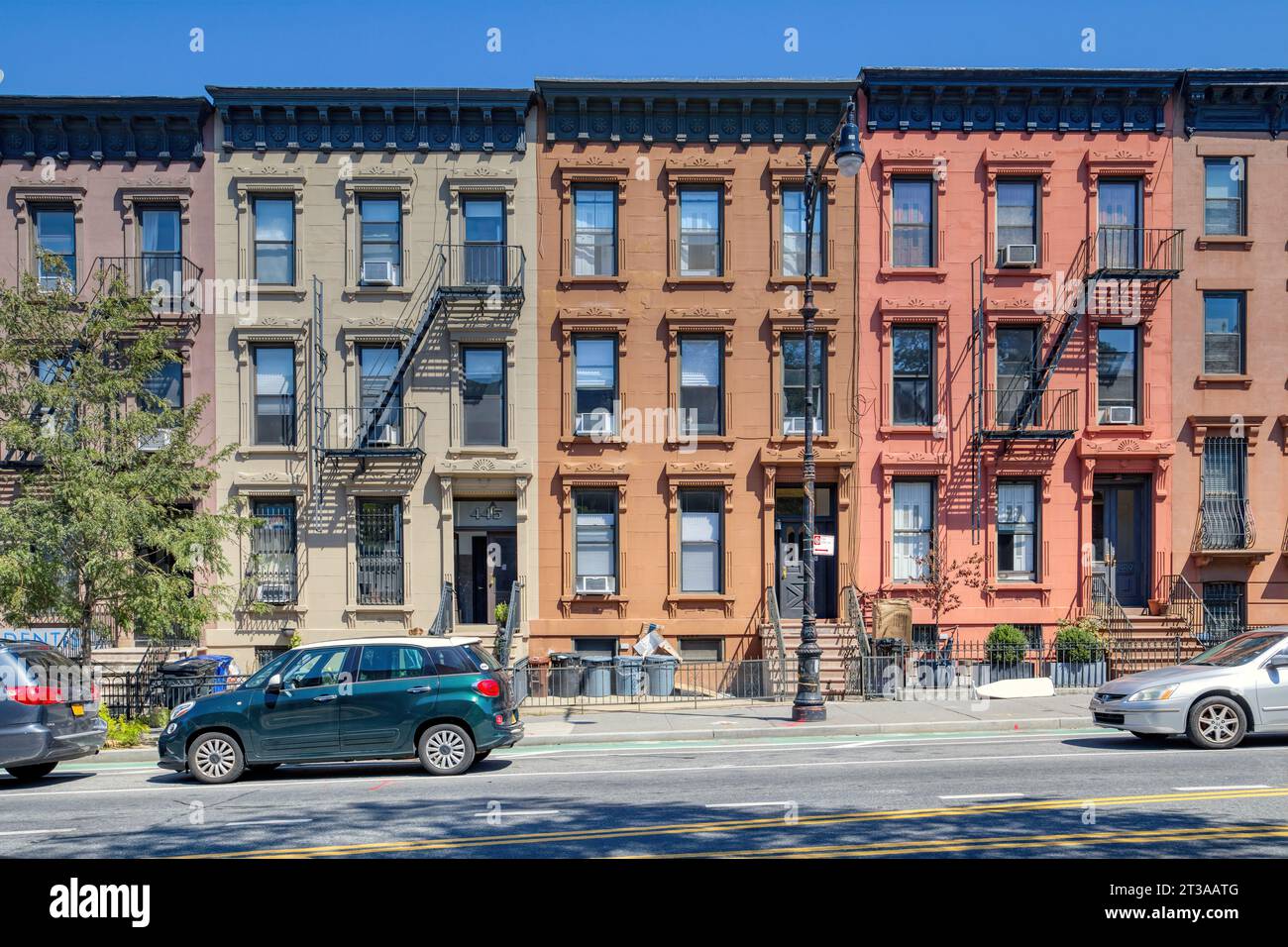 Park Slope, Brooklyn: Painted brownstone flats buildings, part of a set of six neo-Grec flats buildings built in 1881, now NYC designated landmarks. Stock Photo