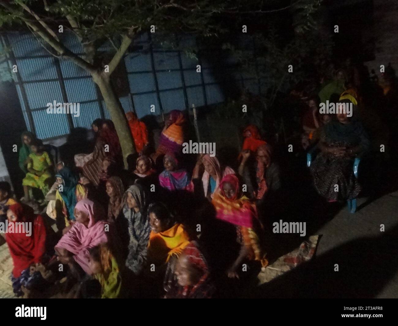 Kushtia, Bangladesh. 24th Oct, 2023. Village people watch pala gaan
