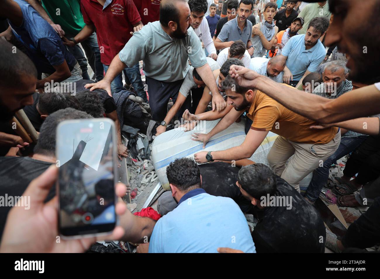 Palestinians Rescue A Survivor Of Israeli Bombardment Of The Gaza Strip ...