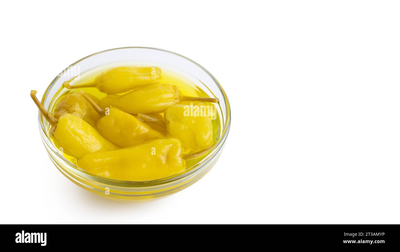Pickled yellow pepper, pepperoncini or friggitelli in bowl isolated on white background. Hot