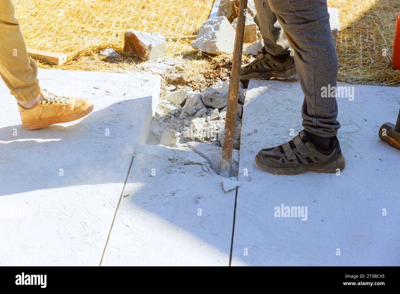 Demolished sidewalk repair concrete pavement restoration in construction works Stock Photo