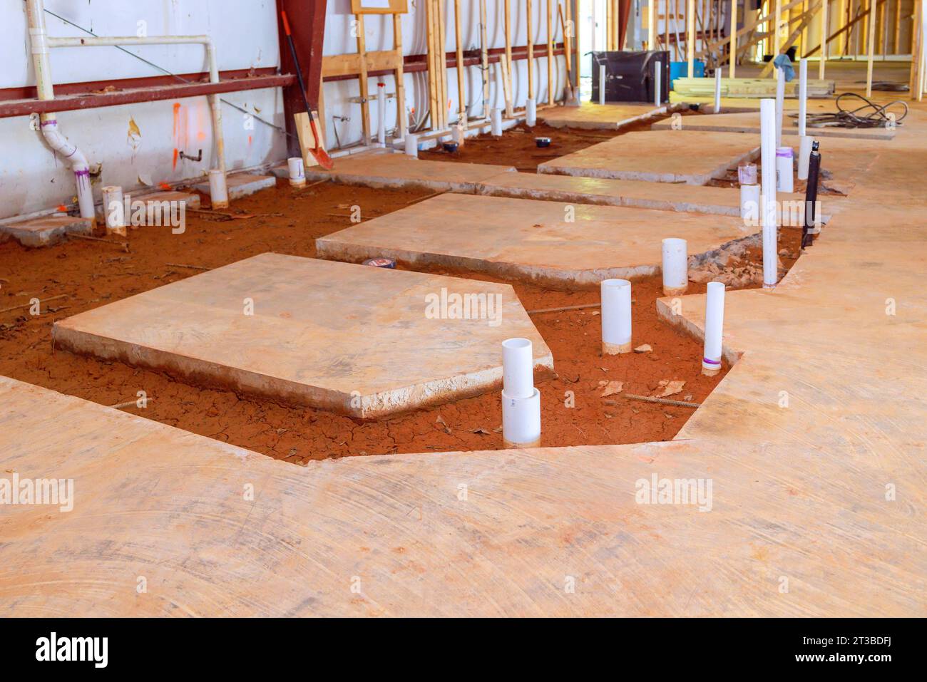 Concrete floor arrangement exposed pvc pipe endings for plumbing future