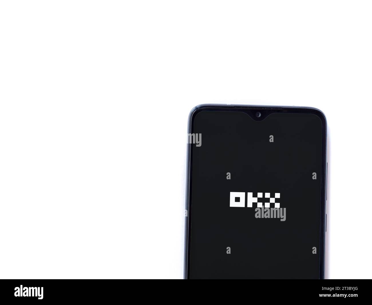 Lod, Israel - July 16,2023: OKX app launch screen on smartphone on white background. Top view flat lay with copy space. Stock Photo