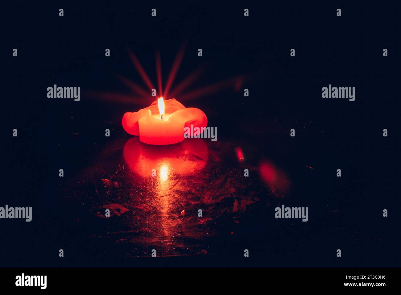 one burning candle with reflection against black background Stock Photo ...