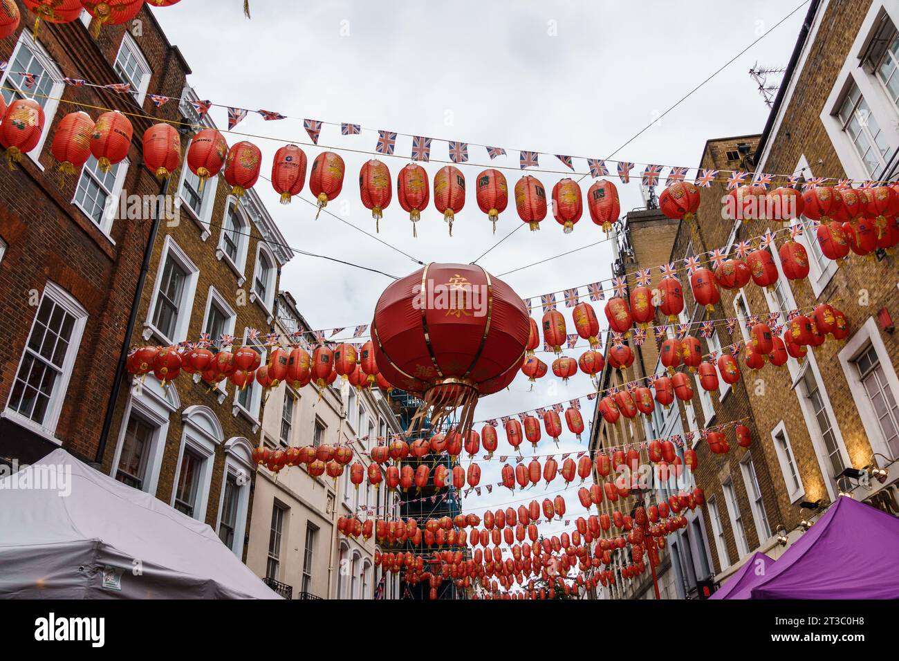 LONDON, UK - August 27, 2023: Chinatown scene in Soho quarter in City of Westminster. It contains a number of Chinese restaurants and shops. Red lante Stock Photo