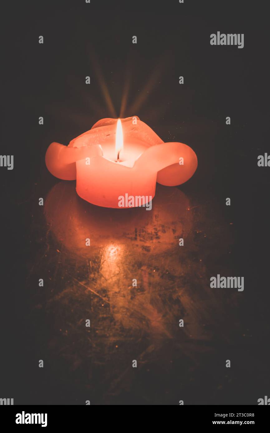 one burning candle with reflection against black background Stock Photo ...