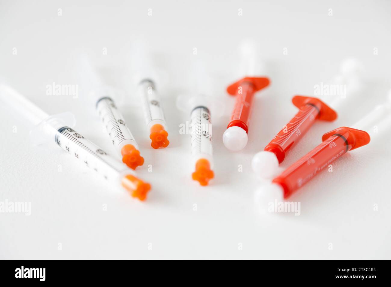 7 syringes on white background Stock Photo