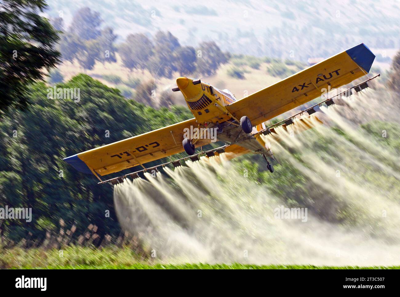 Israeli crop duster Turbo Thrush during crop dusting mission in Hula Valley, Israel. Stock Photo