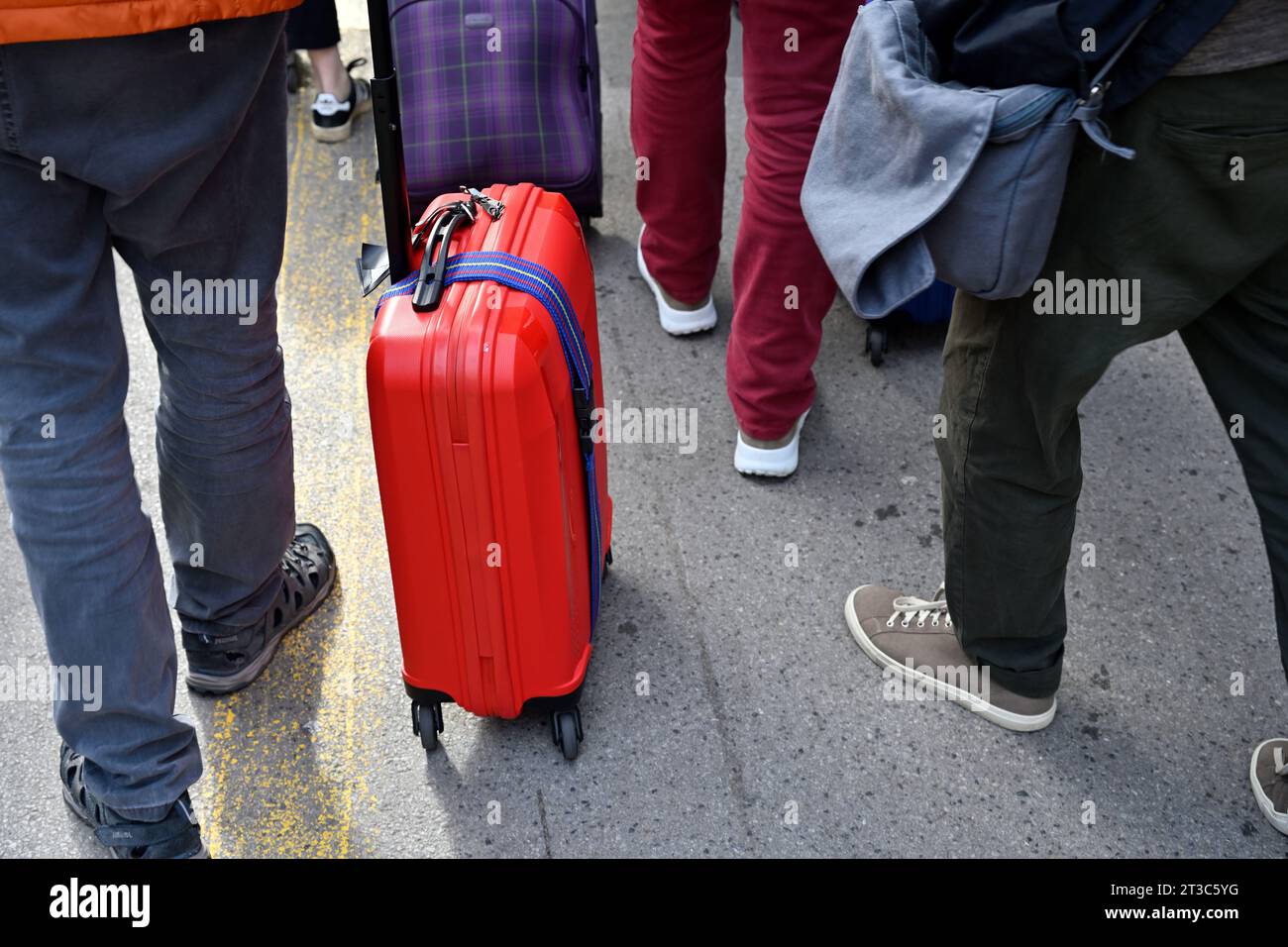 People travelling with wheeling a suitcase Stock Photo