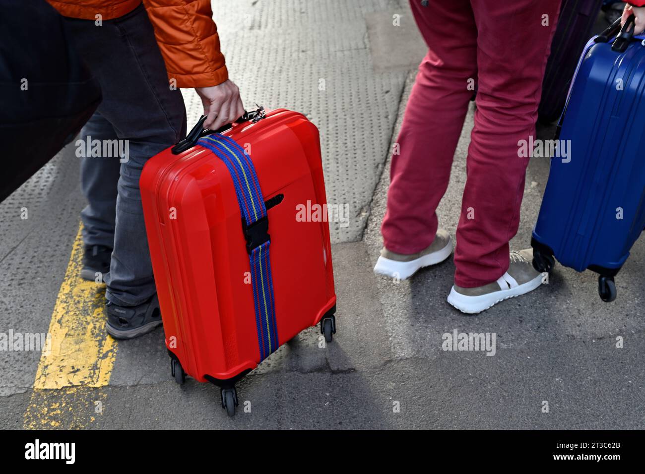 People travelling with wheeling a suitcase Stock Photo