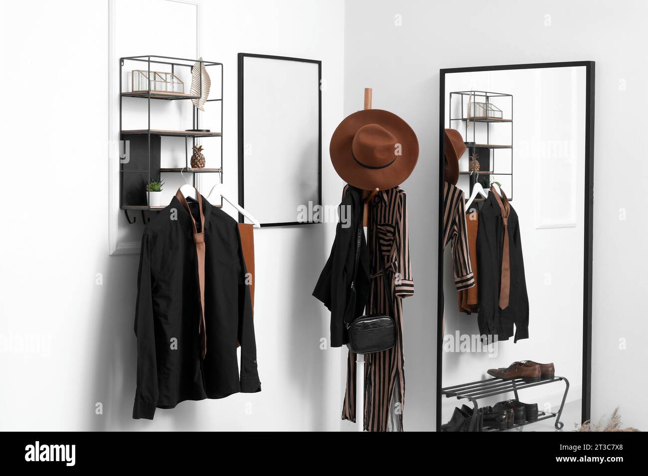 Interior of light hallway with mirror, rack and shelves Stock Photo - Alamy