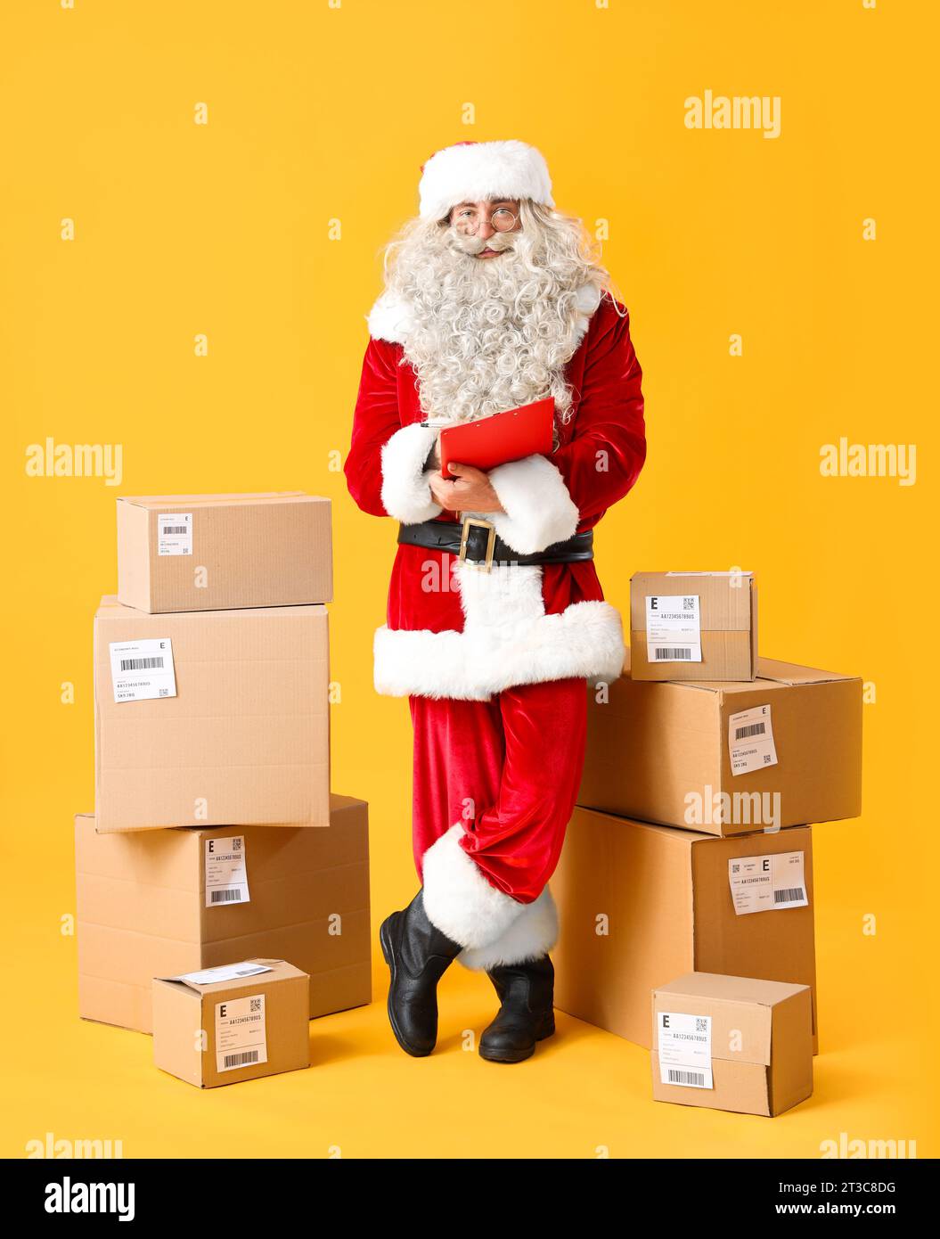 Santa Claus with clipboard checking list of parcels on yellow ...