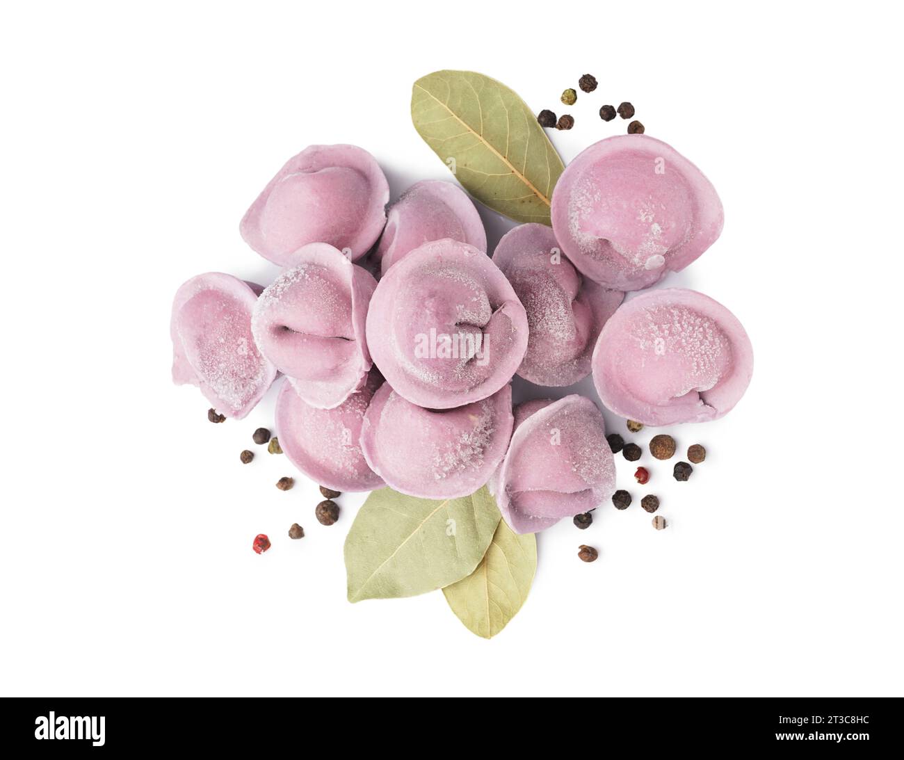 Purple raw dumplings with peppercorn and bay leaves on white background ...
