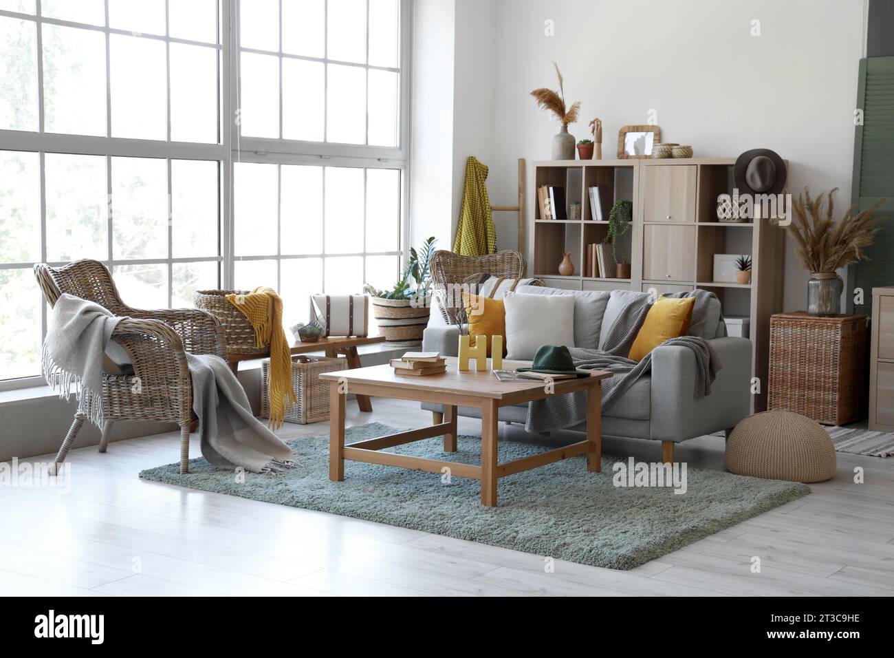 Interior of living room with grey sofa and table Stock Photo - Alamy
