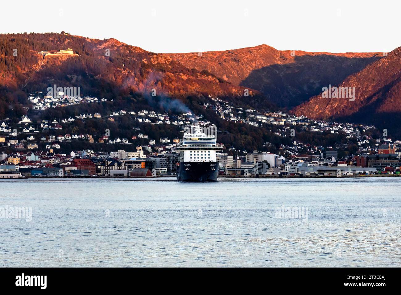 Cruise ship Mein Schiff 3 at Puddefjorden, departing late evening from the port of Bergen, Norway. Stock Photo