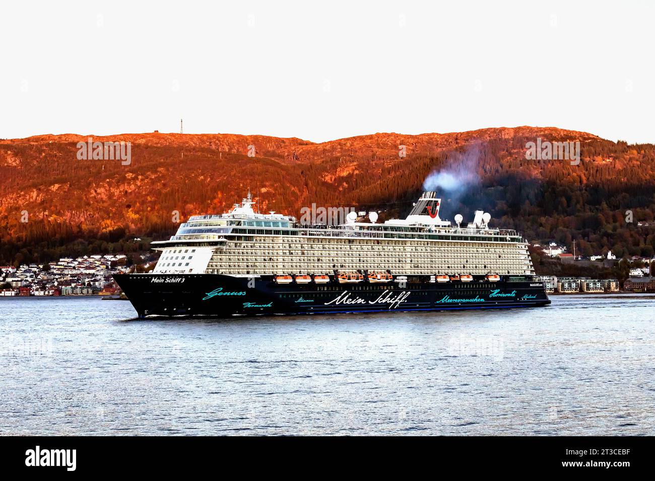 Cruise ship Mein Schiff 3 at Byfjorden, departing late evening from the port of Bergen, Norway. Stock Photo