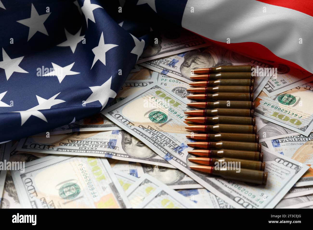 American flag, dollars, bullets, shells, cartridges, ammunition. The concept of lend-lease, army, arms sales. Military industry, war, world arms trade Stock Photo