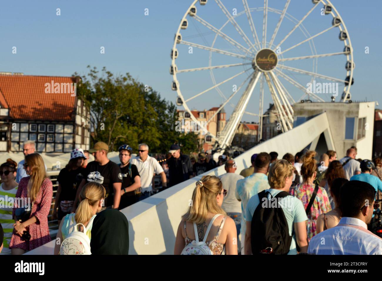 People on Wartka Bridge at the Amber Sky or AmberSky Ferris Wheel in the Old Town of Gdansk, Poland, Europe, EU Stock Photo