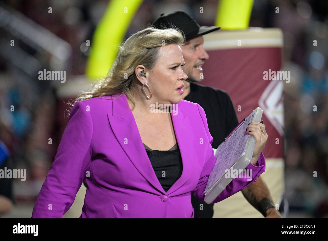 ESPN sideline reporter Holly Rowe walks behind the end zone during the