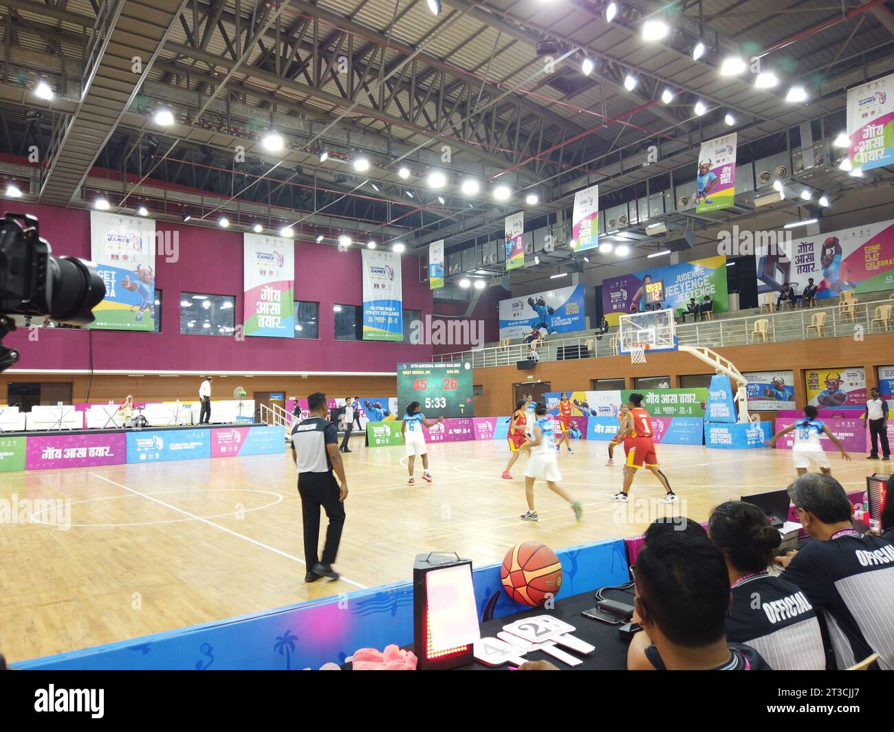 Action from the basketball match between hosts Goa and West Bengal of the National Games taking place at Manohar Parrikar Indoor stadium in Navelim village in the Indian state of Goa. The formal inauguration will take place on October 26 with Prime Minister Narendra Modi formally opening the championship at a function at Fatorda stadium. Stock Photo