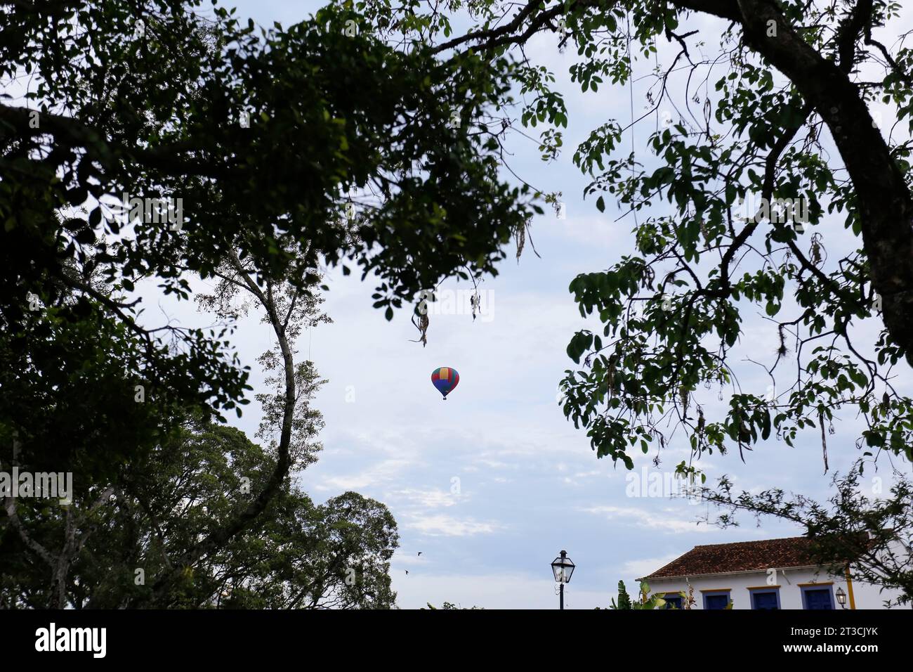 Tiradentes, Minas Gerais, Brazil - October 07, 2023: a manned balloon flies over the city historic Tiradentes, interior of Minas Gerais Stock Photo