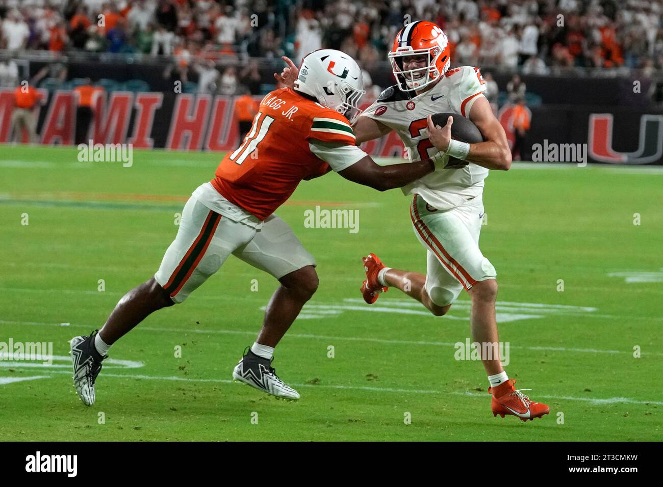 Miami linebacker Corey Flagg Jr. (11) prepares to tackle Clemson