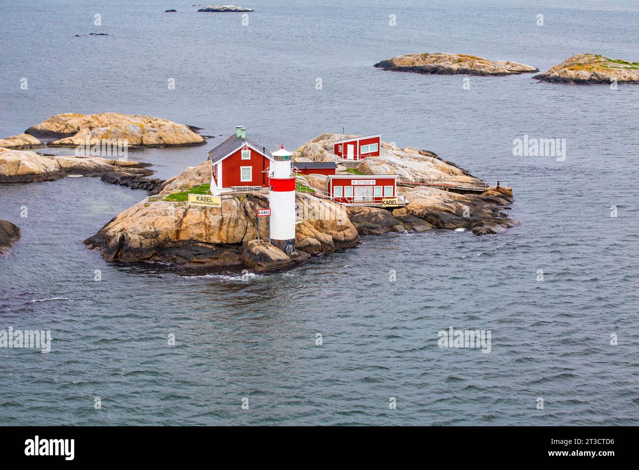 Typical Lighthouse Typical tiny archipelago island with lighthouse and lighthouse keeper's ...
