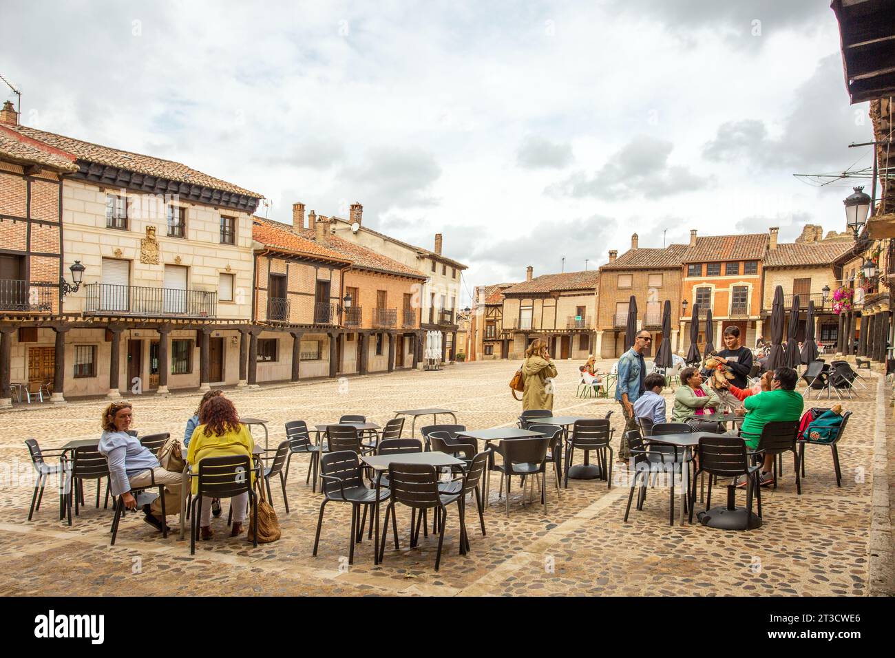 People outside in the Plaza mayor in the Spanish city of Saldana North Western Spain Stock Photo