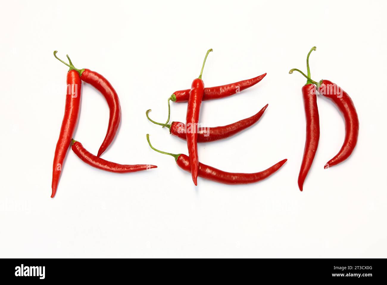 Red chilli peppers arranged to spell out RED HOT CHILI . The chillies