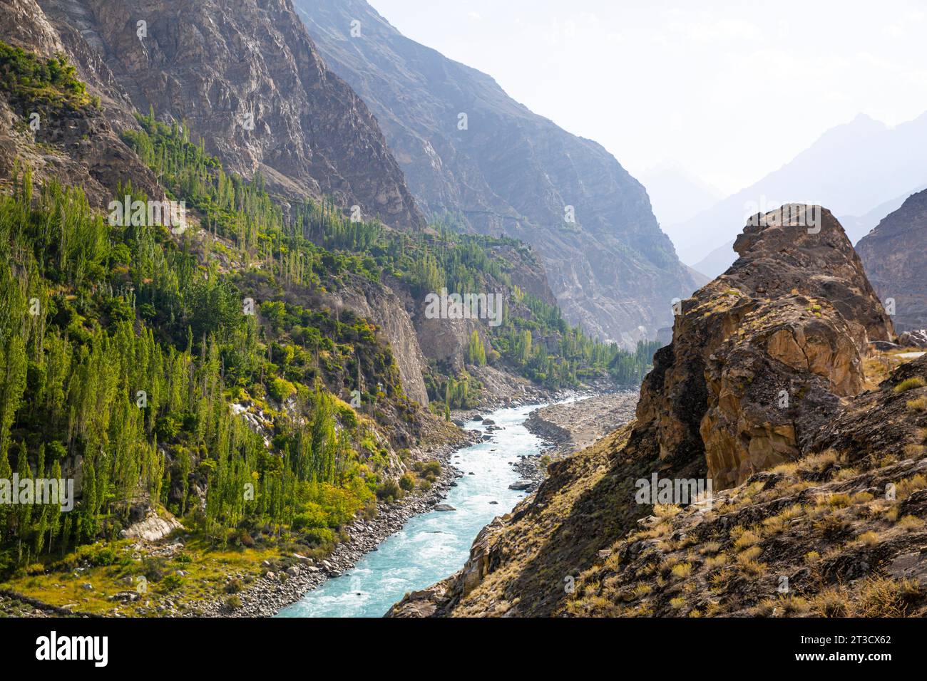 Hunza river in upper Hunza, beautiful turquoise water and rocky Karakorum mountains in Pakistan. Stock Photo