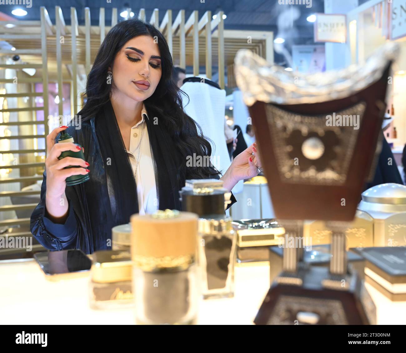 Hawalli, Kuwait. 24th Oct, 2023. A woman tries a perfume at a perfumes