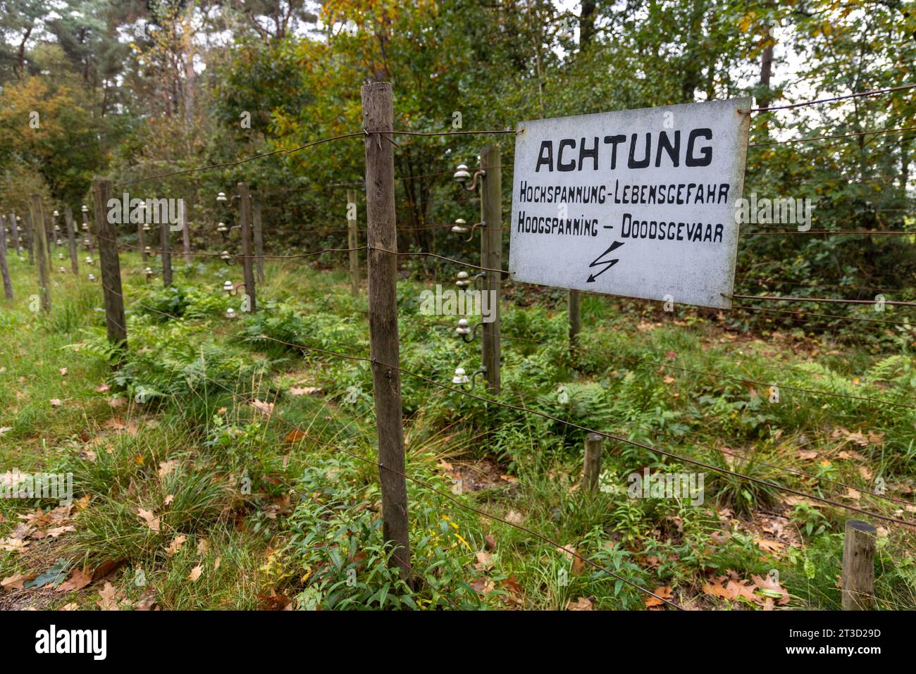 De Doodendraad near Hamont-Achel not far from Achelse Kluis, at border between Belgium & the Netherlands w/ sign 'Achtung Hochspannung Lebensgefahr' Stock Photo