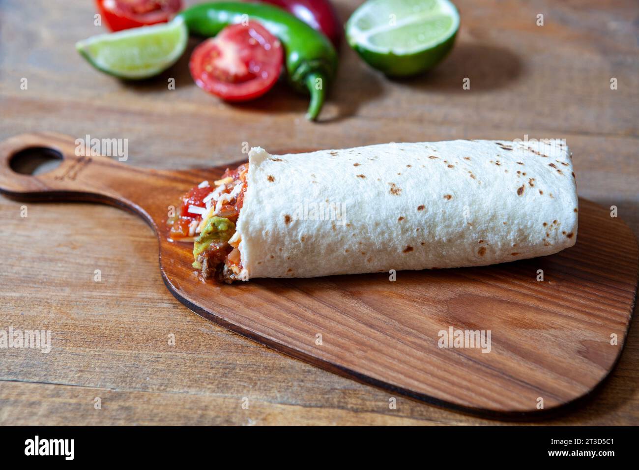 Burrito on wood board Stock Photo