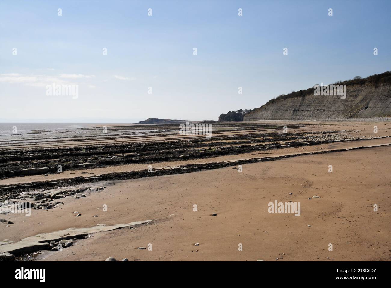 Deserted beach at Lavernock Point in Wales UK, Welsh coast coastline Quiet empty beach seaside British coast Scenic view of beach and sky Stock Photo