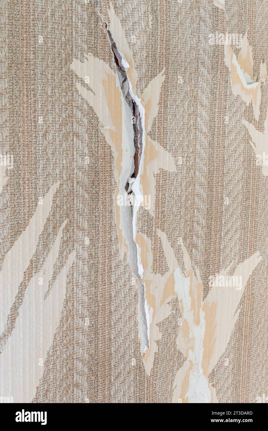 Cracks in an apartment, crack with peeling plaster on a wall Stock Photo Alamy