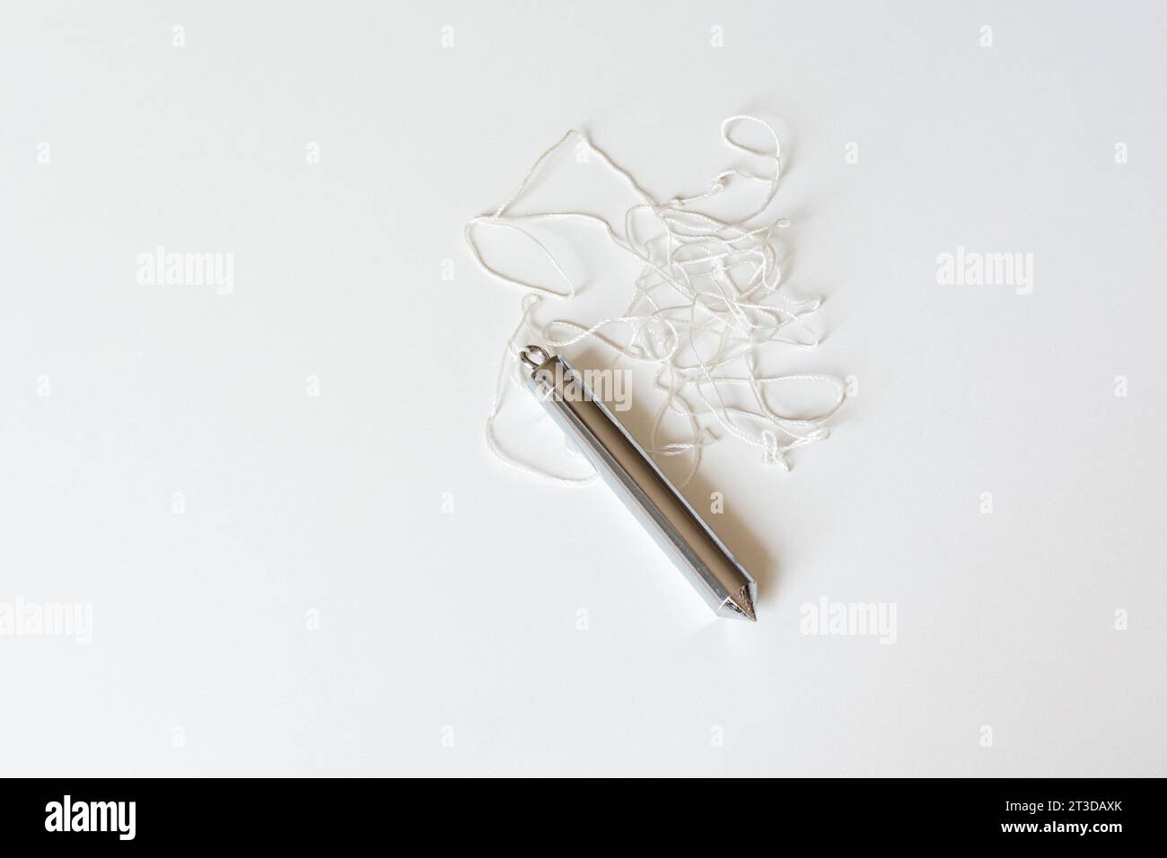 Installing wallpaper. Upholsterer's plumb line Stock Photo Alamy