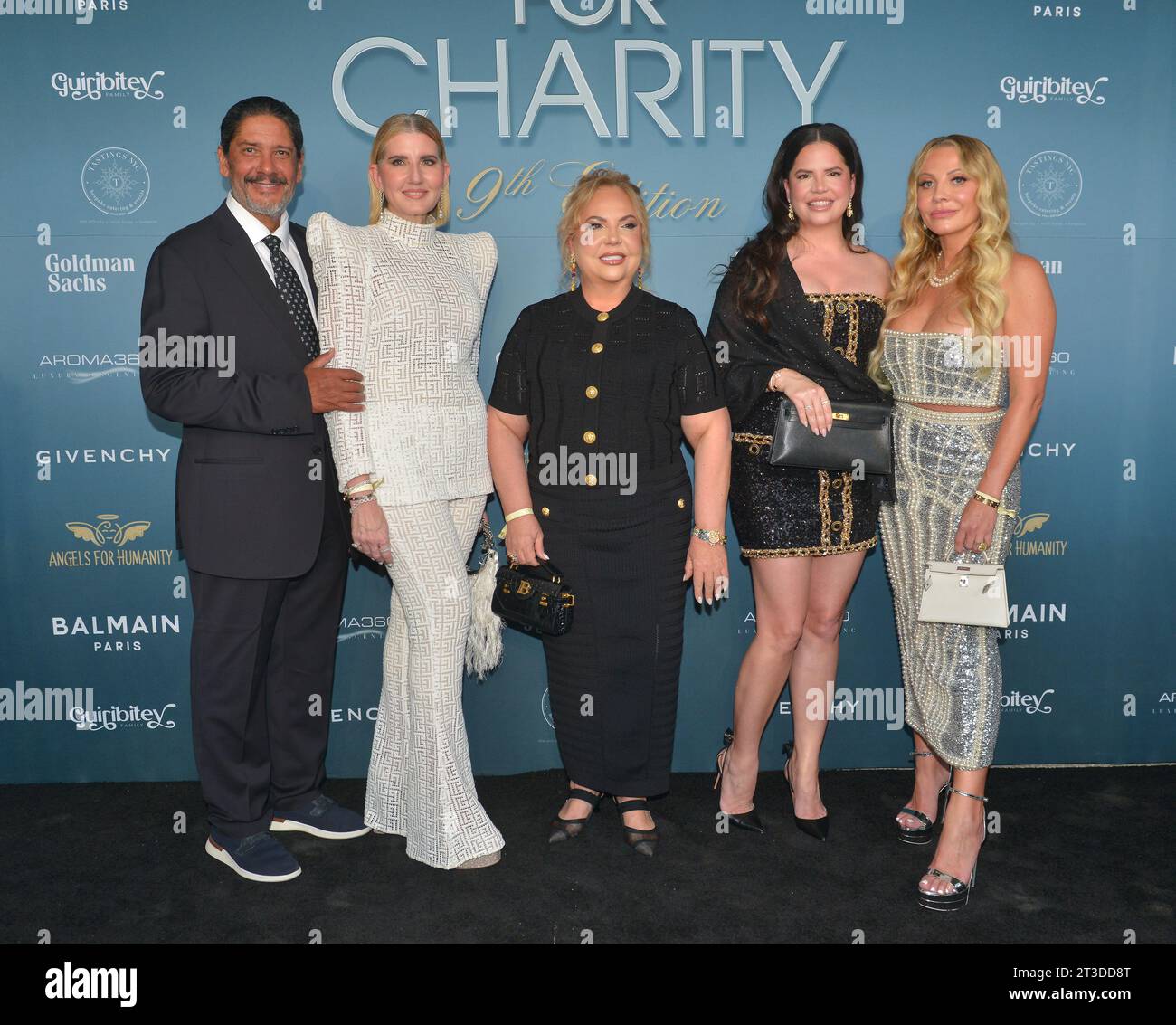 MIAMI, FLORIDA - OCTOBER 22: Jorge Luis Lopez, Marile Luis Lopez, Tatiana Guiribitey, Camila Guiribitey and Regina Lynch Moskow attend Angels for Humanity's 9th Annual Catwalk for Charity Fashion show at The Perez Arts Museum Miami on October 22, 2023 in Miami, Florida. Credit: MPI10 / MediaPunch Stock Photo