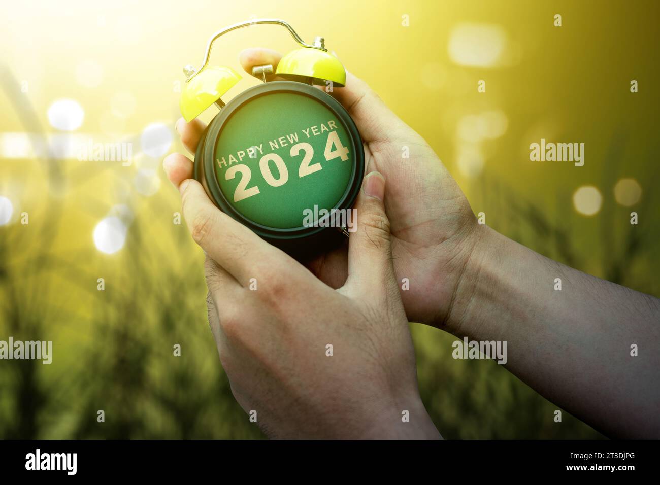 Human hand holding clock 2024. Happy New Year 2024 Stock Photo Alamy